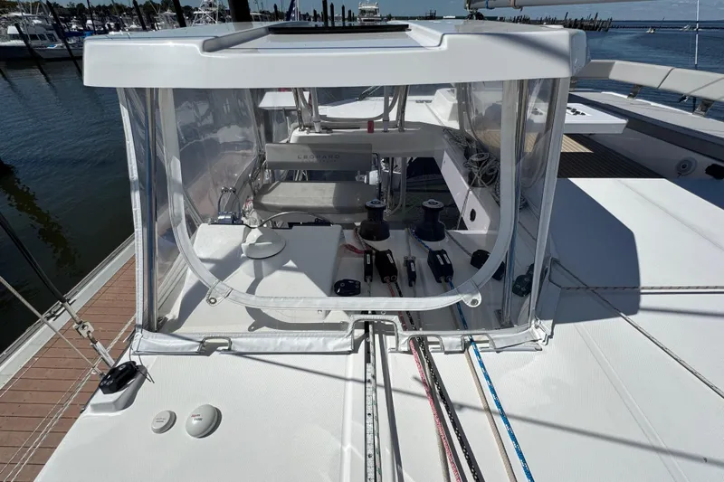 Jolly Time Yacht Photos Pics Leopard 42 catamaran cockpit, 2021 model, featuring modern sailing equipment and clear enclosure.