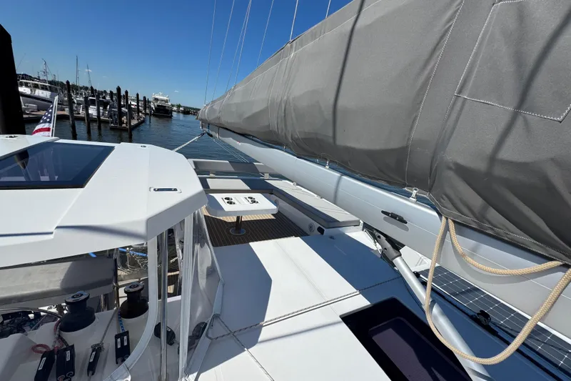 Jolly Time Yacht Photos Pics Modern 2021 Leopard 42 catamaran docked, featuring sleek design and spacious deck.