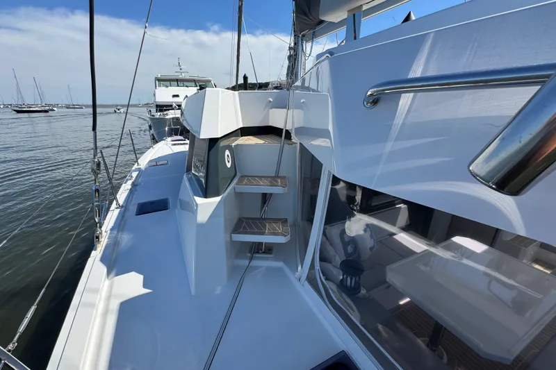Jolly Time Yacht Photos Pics Modern Leopard 42 catamaran deck, 2021 model, docked with clear skies and calm waters.