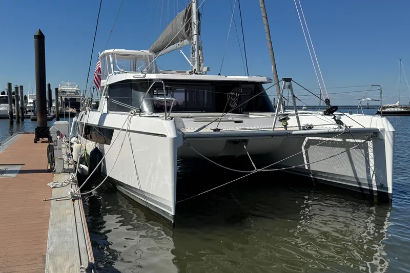 Jolly Time Yacht Photos Pics 2021 Leopard 42 catamaran docked at marina under clear blue sky.