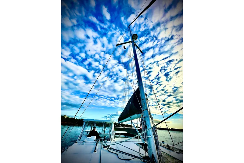 Jolly Time Yacht Photos Pics Sailing on a 2021 Leopard 42 catamaran under a vibrant blue sky.