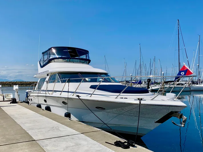  Yacht Photos Pics Luxury Prima 5230 yacht docked at marina, clear blue sky, 1999 model.