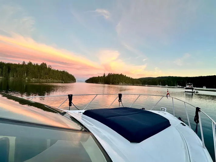  Yacht Photos Pics Boat on serene lake at sunset, Prima 5230, 1999 model.