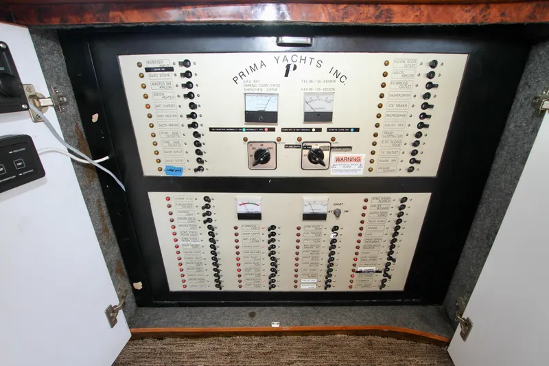  Yacht Photos Pics Electrical control panel of Prima Yachts Inc, model 5230, year 1999, with switches and meters.