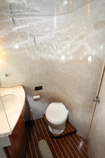  Yacht Photos Pics Luxurious yacht bathroom with modern fixtures, wooden flooring, and elegant design, Prima 5230, 1999.