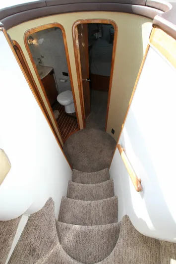  Yacht Photos Pics Staircase leading to bathroom in 1999 Prima 5230 boat interior.