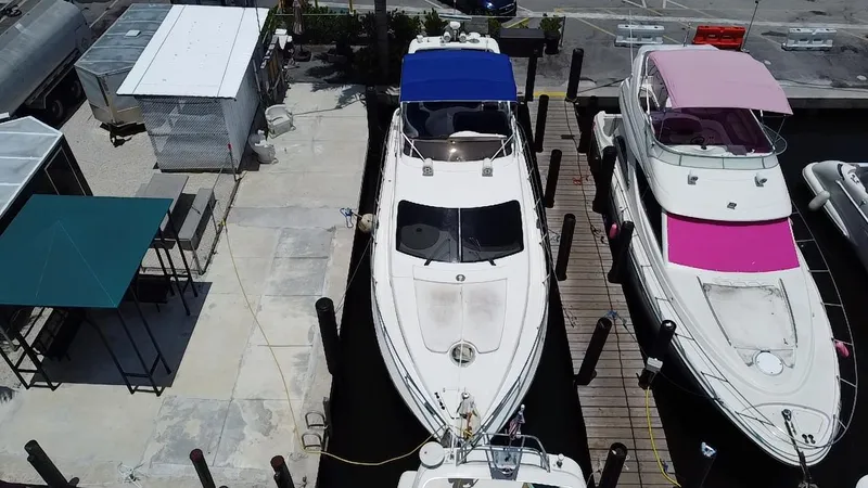  Yacht Photos Pics Overhead view of a 2000 Azimut 46 yacht docked between two other boats.