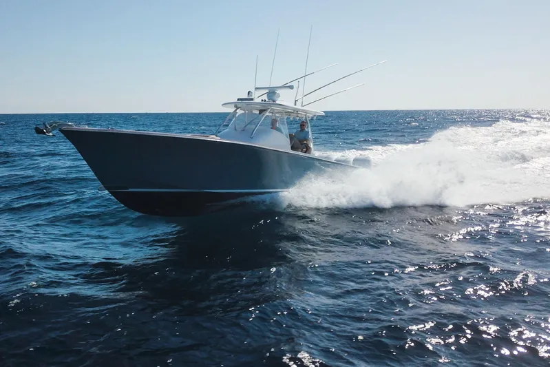  Yacht Photos Pics 2018 Winter Custom Yachts Center Console cruising on open ocean waters.