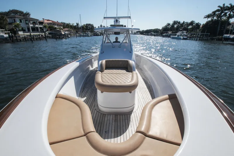  Yacht Photos Pics 2018 Winter Custom Yachts Center Console boat with luxurious seating on a sunny waterway.