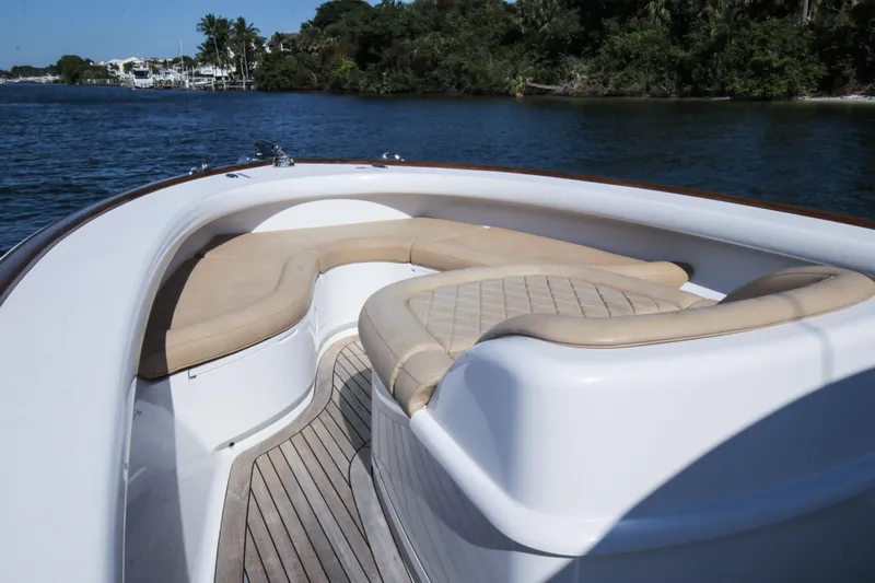  Yacht Photos Pics 2018 Winter Custom Yachts Center Console boat with cushioned seating on calm water.