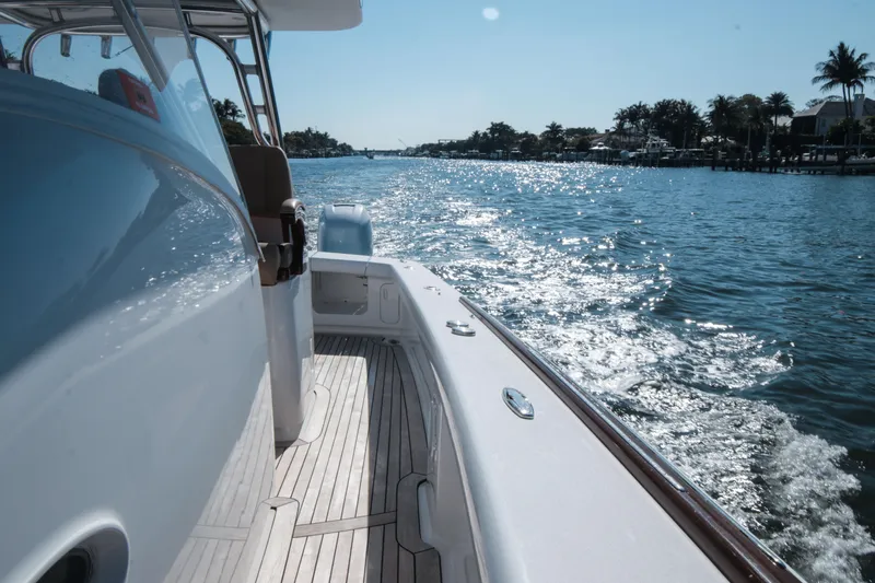  Yacht Photos Pics 2018 Winter Custom Yachts Center Console cruising on a sunny waterway.