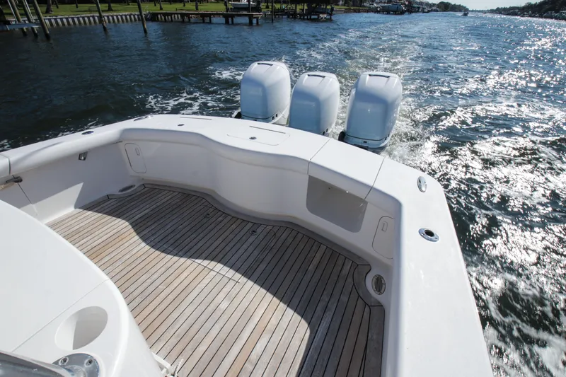  Yacht Photos Pics 2018 Winter Custom Yachts Center Console with triple engines on open water.