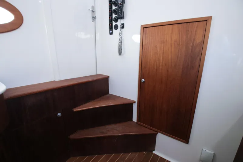  Yacht Photos Pics Interior of 2018 Winter Custom Yachts Center Console with wooden steps and door.