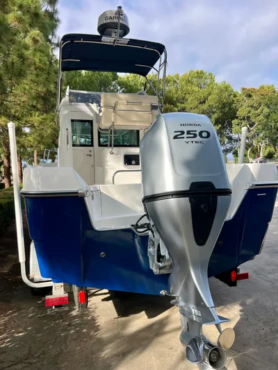  Yacht Photos Pics 2023 NJM NSB-28 boat with Honda 250 VTEC engine, parked outdoors.