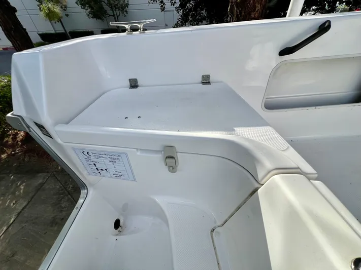  Yacht Photos Pics White NJM NSB-28 boat interior detail, 2023 model, featuring storage compartment and handle.