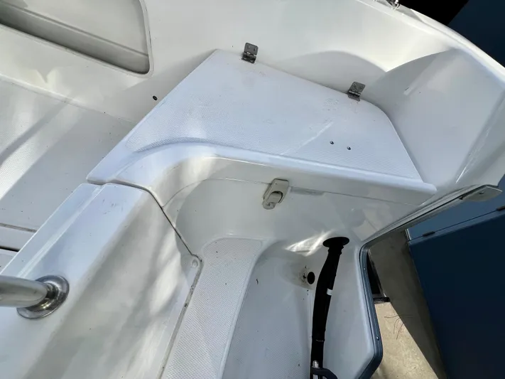  Yacht Photos Pics White interior of 2023 NJM NSB-28 boat, featuring a clean, textured seating area.