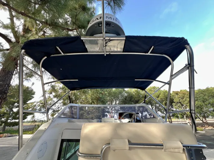  Yacht Photos Pics 2023 NJM NSB-28 boat with canopy and radar, parked outdoors.