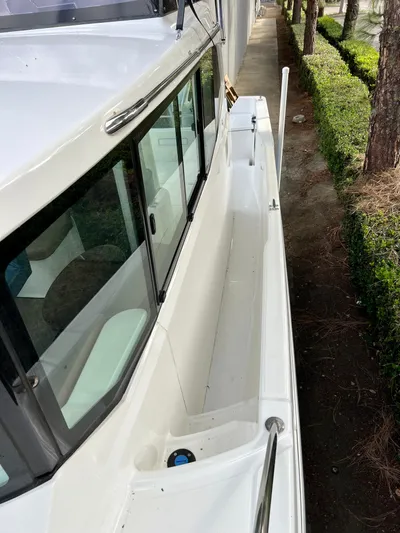  Yacht Photos Pics 2023 NJM NSB-28 boat side view with sleek white design and railing.