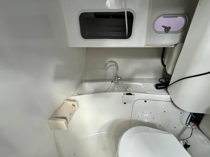  Yacht Photos Pics Compact bathroom interior in NJM NSB-28, 2023 model, featuring sink and toilet.