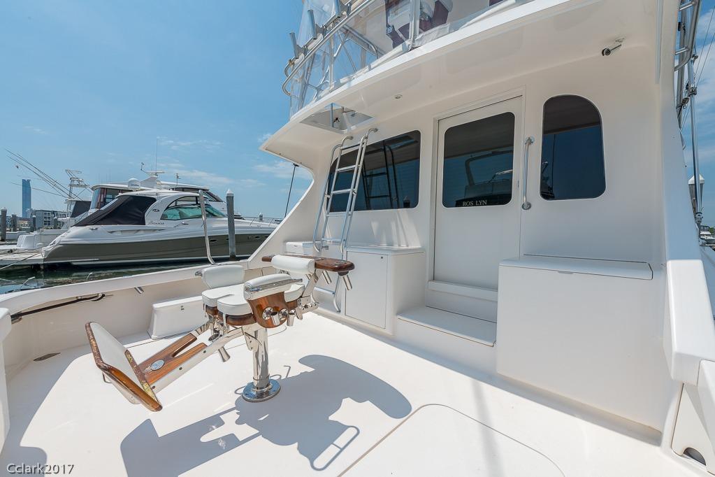 2007 Post 53 Convertible yacht deck with fishing chair, docked at marina.