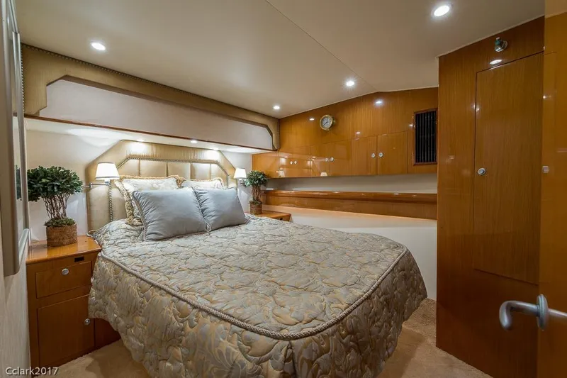 No Pressure Yacht Photos Pics Luxurious bedroom interior of 2007 Post 53 Convertible yacht with elegant wood finishes.