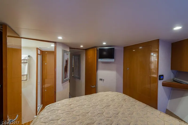 No Pressure Yacht Photos Pics Luxurious interior of 2007 Post 53 Convertible yacht with cozy bedroom and modern amenities.