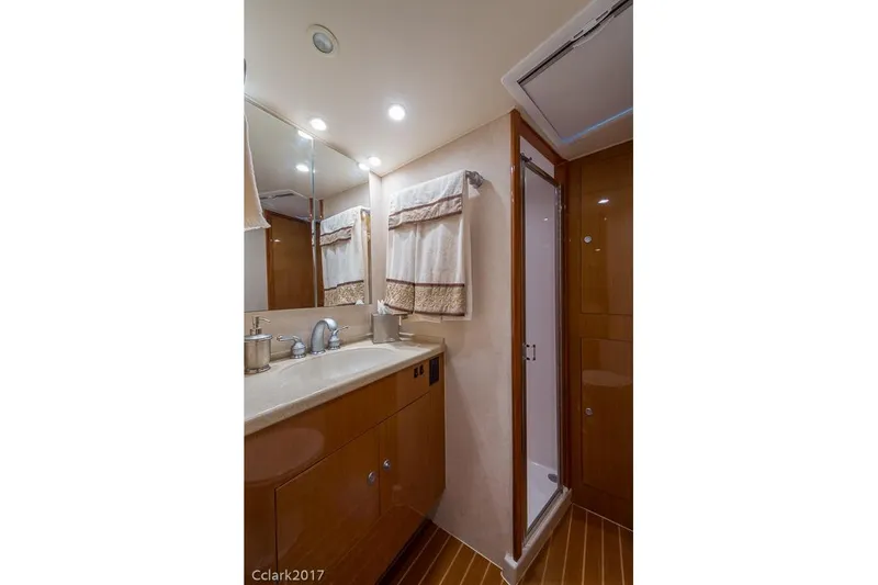 No Pressure Yacht Photos Pics Luxurious bathroom in 2007 Post 53 Convertible yacht with modern fixtures and wooden cabinetry.