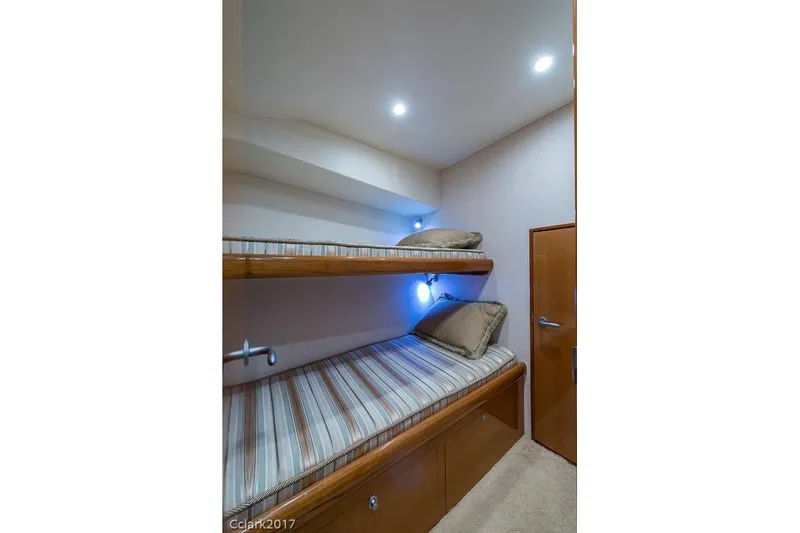 No Pressure Yacht Photos Pics Interior of 2007 Post 53 Convertible with cozy bunk beds and ambient lighting.