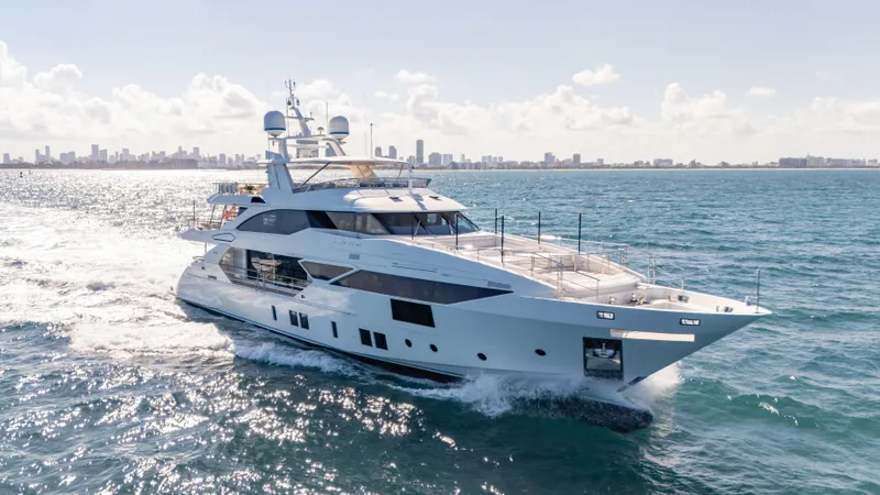 Inspiration Yacht Photos Pics Luxury 2018 Benetti Fast 125 yacht cruising on open sea with city skyline backdrop.