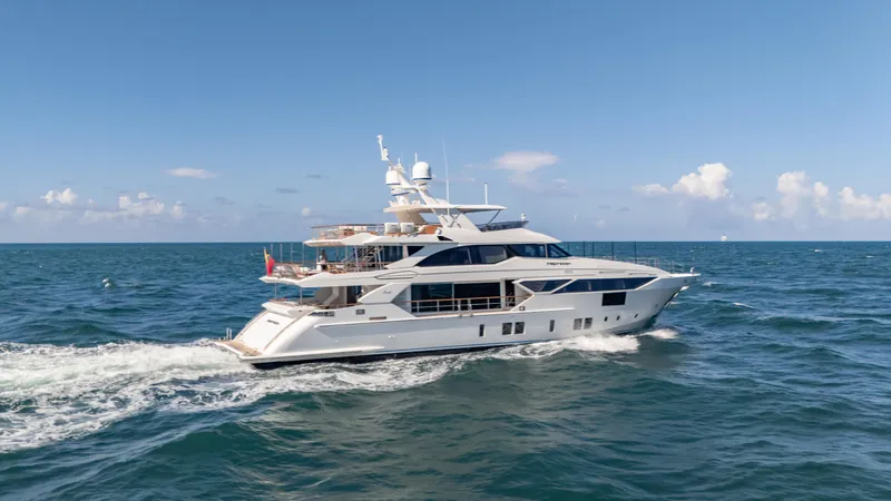 Inspiration Yacht Photos Pics 2018 Benetti Fast 125 yacht cruising on open sea under clear blue sky.