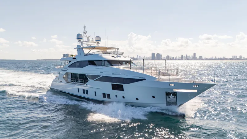 Inspiration Yacht Photos Pics Luxurious 2018 Benetti Fast 125 yacht cruising on open water with city skyline backdrop.