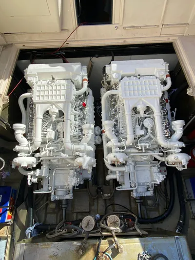  Yacht Photos Pics Twin engines of a 1989 Riva 51 Turborosso yacht, showcasing intricate mechanical details.