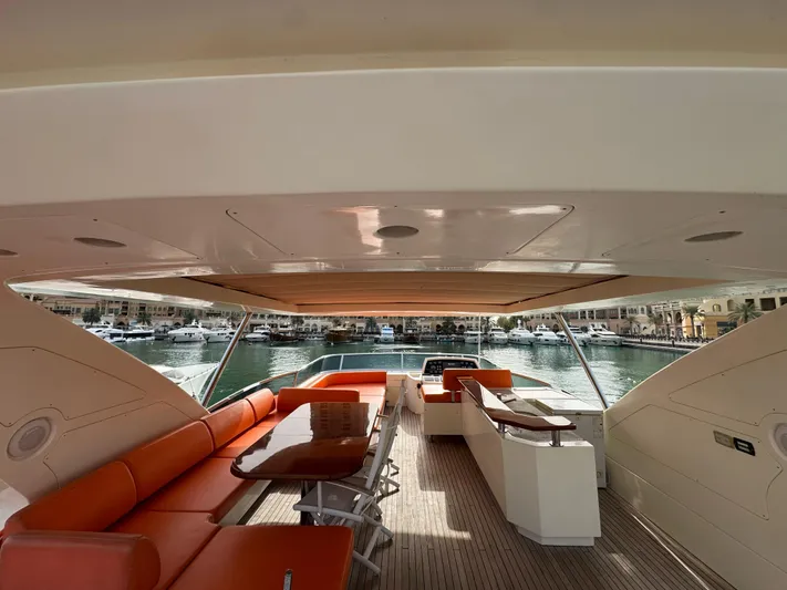 G-one Yacht Photos Pics Luxurious 2009 Azimut 82 yacht interior with orange seating and waterfront view.
