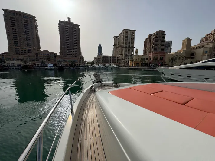 G-one Yacht Photos Pics Luxurious 2009 Azimut 82 yacht docked in a modern marina with city skyline.