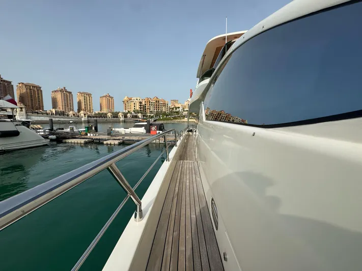 G-one Yacht Photos Pics 2009 Azimut 82 yacht docked at marina with cityscape background.