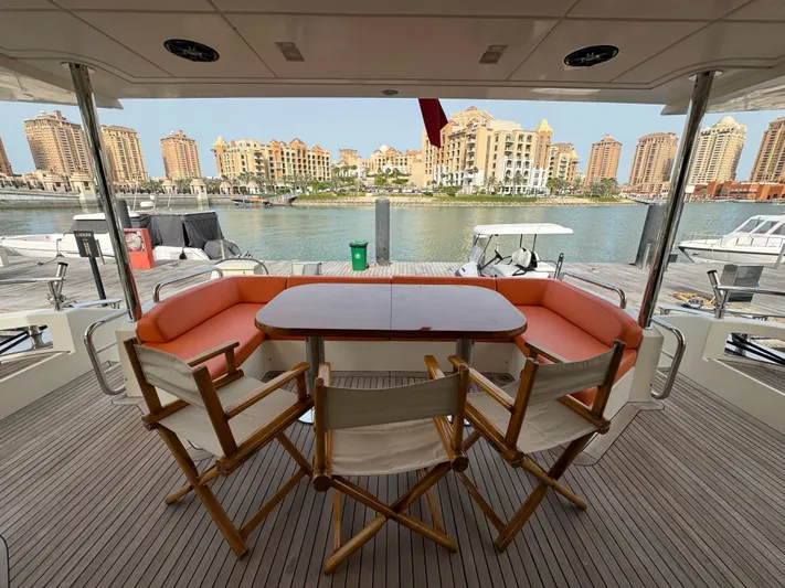 G-one Yacht Photos Pics Luxury yacht Azimut 82 (2009) deck with waterfront cityscape view.