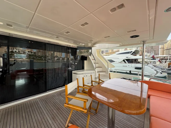 G-one Yacht Photos Pics Luxurious 2009 Azimut 82 yacht deck with seating and marina view.