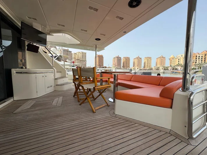 G-one Yacht Photos Pics Luxurious 2009 Azimut 82 yacht deck with seating, table, and marina view.