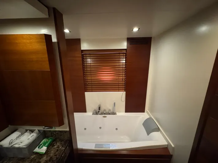 G-one Yacht Photos Pics Luxurious bathroom with a jacuzzi tub on a 2009 Azimut 82 yacht.