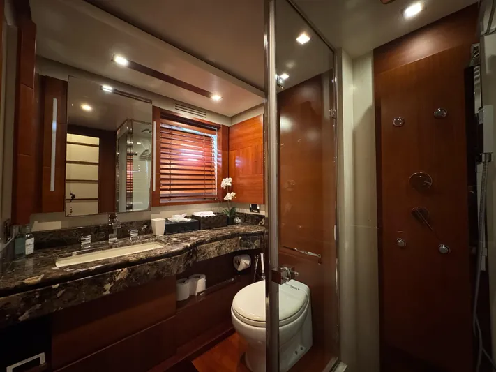 G-one Yacht Photos Pics Luxurious bathroom in a 2009 Azimut 82 yacht, featuring elegant wood finishes and modern amenities.