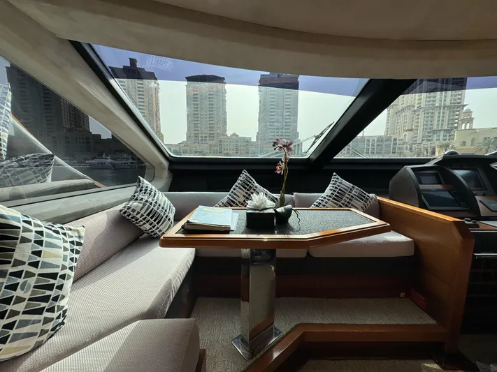G-one Yacht Photos Pics Luxurious interior of a 2009 Azimut 82 yacht with city skyline view.