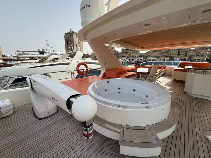 G-one Yacht Photos Pics Luxurious 2009 Azimut 82 yacht deck with jacuzzi and seating area.
