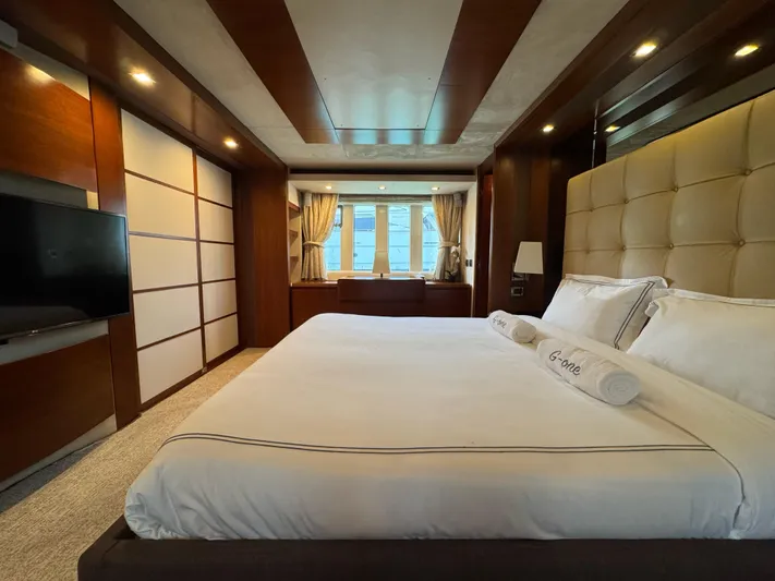 G-one Yacht Photos Pics Luxurious bedroom interior of 2009 Azimut 82 yacht with elegant furnishings and large bed.