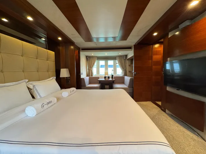 G-one Yacht Photos Pics Luxurious bedroom interior of 2009 Azimut 82 yacht with elegant furnishings and modern amenities.