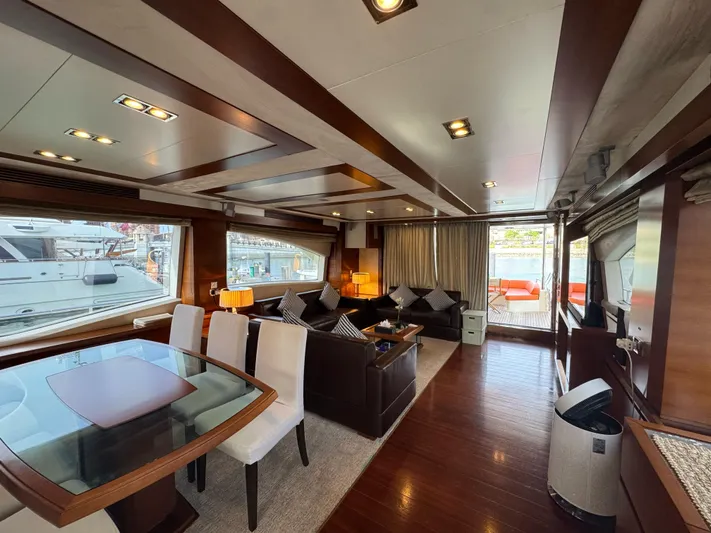 G-one Yacht Photos Pics Luxurious interior of a 2009 Azimut 82 yacht with elegant dining and seating areas.