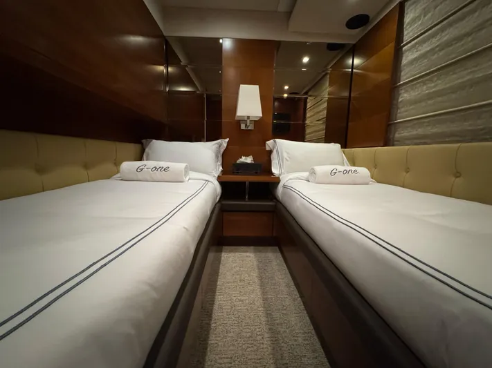 G-one Yacht Photos Pics Luxurious twin cabin interior of 2009 Azimut 82 yacht with elegant bedding.