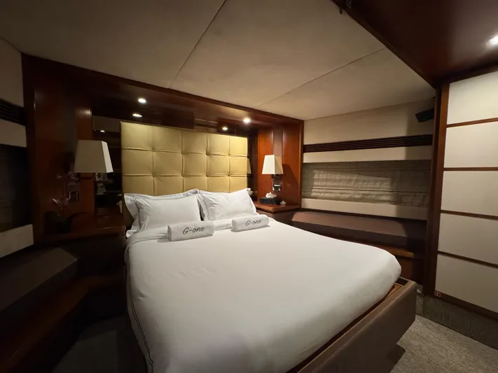 G-one Yacht Photos Pics Luxurious bedroom interior of 2009 Azimut 82 yacht with elegant lighting and plush bedding.