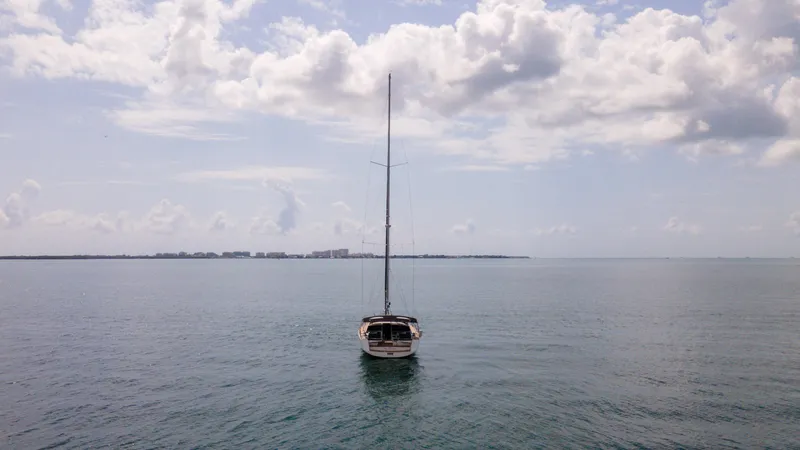 Indigo Dream Yacht Photos Pics Sailboat Beneteau Sense 50 (2012) on calm sea under cloudy sky.