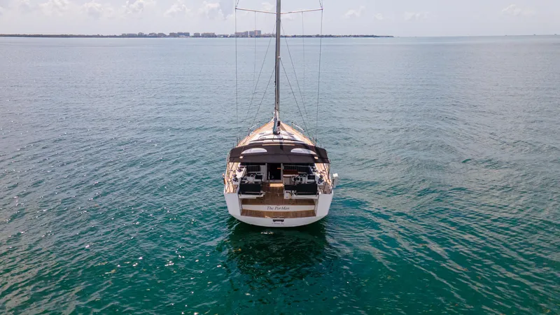 Indigo Dream Yacht Photos Pics Sailing yacht Beneteau Sense 50 (2012) on calm ocean waters, viewed from the rear.