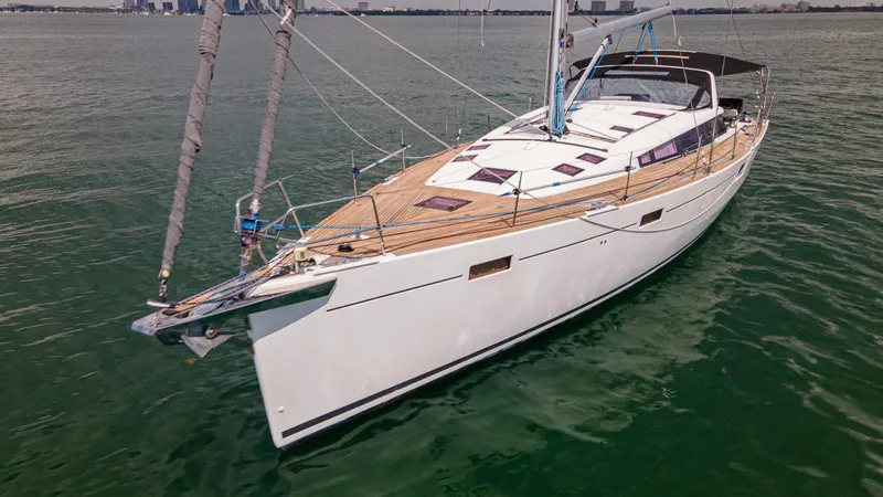 Indigo Dream Yacht Photos Pics 2012 Beneteau Sense 50 yacht on calm water, showcasing sleek design and spacious deck.